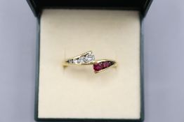 Hallmarked 18ct yellow gold ruby and diamond offset crossover eternity ring, comprising four
