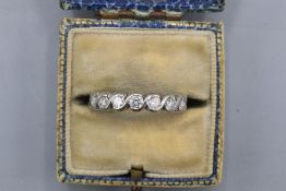 Hallmarked 18ct white gold diamond half eternity ring, comprising seven round brilliant-cut diamonds