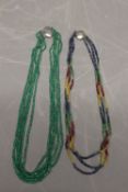 Two strung gemstone necklaces, comprised of a five strand strung faceted emerald bead necklet,