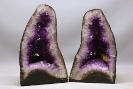 Complimenting pair of amethyst pyramid cathedral geodes, comprised of opposing pyramid geodes,