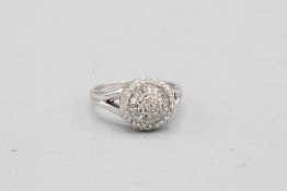 Hallmarked 18ct white gold diamond cluster ring, comprising a circular cluster of round brilliant-