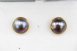 Stamped 18ct yellow gold Haitian pearl earrings, comprising two large dark lustrous pearl