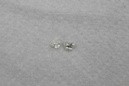 Matched pair of GIA certificated natural heart brilliant-cut diamonds, total weight 0.79ct,