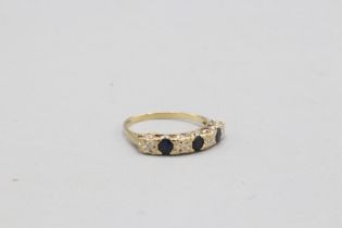 Hallmarked 9ct yellow gold illusion-set diamond and sapphire eternity ring, comprising four round