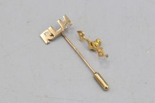 Gold R.L.H form jewellery, comprised of a stamped 14ct yellow gold R.L.H. pin badge with white topaz