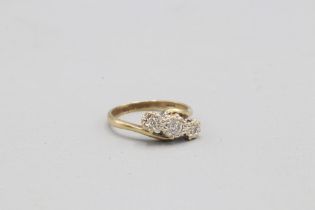 Hallmarked 9ct yellow gold offset diamond trilogy ring, comprising one central round brilliant-cut