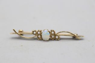 Hallmarked 9ct yellow gold bar brooch, centrally set with an oval opal cabochon with hairline