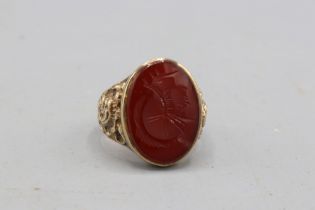 Stamped 9ct yellow gold intaglio signet ring, comprised of one oval carnelian stone measuring