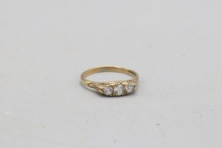 Hallmarked 9ct yellow gold cubic zirconia boat head trilogy ring, comprised of three round brilliant
