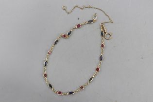 Hallmarked 9ct yellow gold sapphire and ruby chain link bracelet, comprised of alternating bezel-set