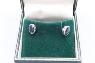 Unmarked earrings, XRF tested as 18ct white gold, comprising a pair of oval bezel-set earrings, each
