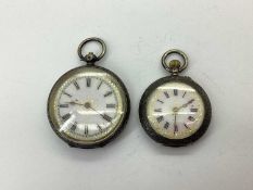 Two Decorative Antique Fob Watches, each with black Roman numerals and gilt highlights, within