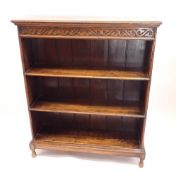 A late 19th century oak open three shelf bookcase with carved frieze, 91cm wide