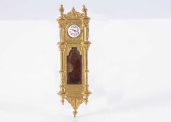 A late 19th century German gilt metal dolls’ house wall clock,