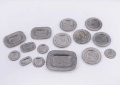 A set of 19th century dolls’ house pewter plates,