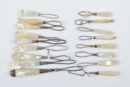Seventeen mother or pearl and shell button loops,