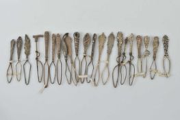 A collection of small silver button or glove loops,