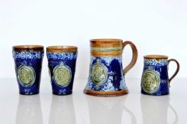 A small selection of Doulton Lambeth Commemorative stoneware items,