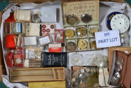 A collection of pocket watch movements and other spare parts and tools,