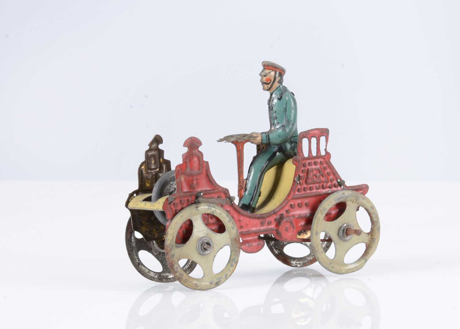 An early 20th century German fly-wheel driven tinplate Penny Toy ...