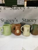 A collection of vintage British Royal Commemorative ceramic mugs and tankards.