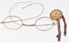 A 9ct gold watch and strap (16.7g) and 9ct gold glasses frames (5.1g)