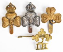 Four Irish cap badges and shoulder titles including 29th Battalion Irish Horse (Imperial