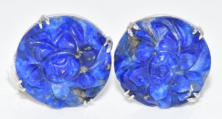 A pair of 9ct white gold earrings set with carved lapis lazuli in the form of a flower, 5.8g