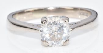 An 18ct white gold ring set with a round brilliant cut diamond of approximately 0.85ct, 3.6g, size L