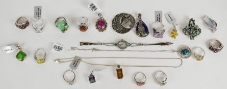 A collection of silver jewellery including two brooches, watch set with emeralds, seven pendants