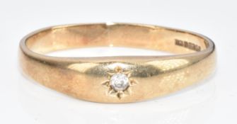 A 9ct gold ring set with a diamond in a star setting, 2.8g, size X
