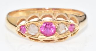 An 18ct gold ring set with synthetic sapphires and rose cut diamonds, Birmingham 1919, 2.7g, size O