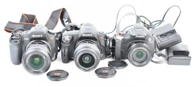Three digital cameras comprising Sony a290 with 3.5-5.6/18-55 SAM lens, Sony a350 with 3.5-5.6/18-70