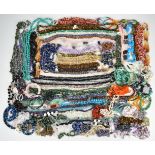 A large collection of mainly certificated beads including amethyst, green agate, smoky quartz and