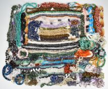 A large collection of mainly certificated beads including amethyst, green agate, smoky quartz and
