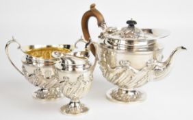 Victorian hallmarked silver three piece teaset with embossed decoration, London 1892, maker John