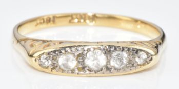 An 18ct gold ring set with five spinel, 2.7g, size N