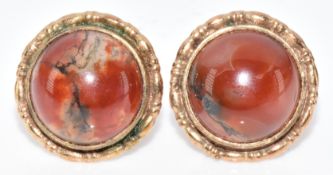 A pair of 9ct gold earrings set with moss agate cabochons, 2.4g