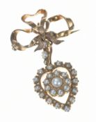 Edwardian brooch in the form of a bow and heart set with rose cut diamonds and split pearls, 11.