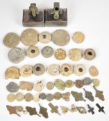 Roman and later spindle whorls, seals and tokens, Christian pendants, mounted bronze pipe and