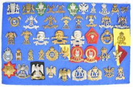 Approximately 46 cap badges and insignia, mainly Lancer related including Reserve Regiment, 15th