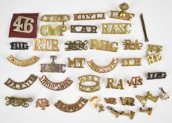 Approximately 30 shoulder titles and insignia including Shropshire, Territorial RAMC, Foresters,