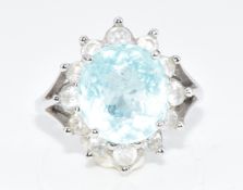 A white metal ring set with an oval cut greenish blue Paraiba tourmaline of approximately 3.6ct