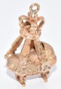 A 9ct gold charm in the form of a crib and baby, 4.9g, 2.2cm