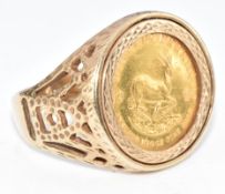A 9ct gold ring set with a 1984 one tenth gold Krugerrand, 8.3g, size Q