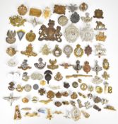Approximately 65 cap badges including Tyneside Scottish, WW2 Polish Army, Argyll and Sutherland, The