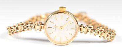 Garrard 9ct gold ladies wristwatch with gold hands and baton hour markers, silver dial and quartz