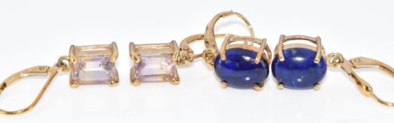Two pairs of 9ct gold earrings, one pair set with lapis lazuli cabochons and the other ametrine,