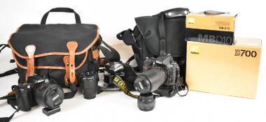 Nikon DSLR camera outfit comprising D700 and D100 digital SLR bodies, MB-D10 battery pack, AF-S