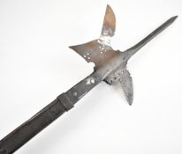 An antique polearm, possibly 19thC or earlier, the ash pole of square form, the head riveted for